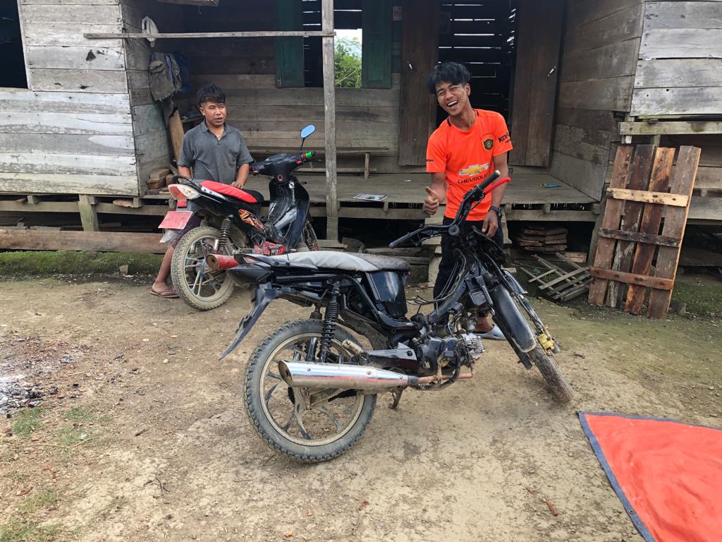 Burmese youths display their Chinese Kenbo motorcycles which they use to move in and pit of the border (Photo: Bidhayak Das)