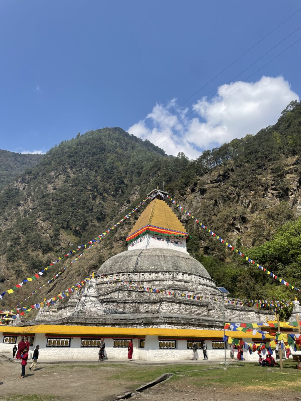 Buddhist stupa against a hill
