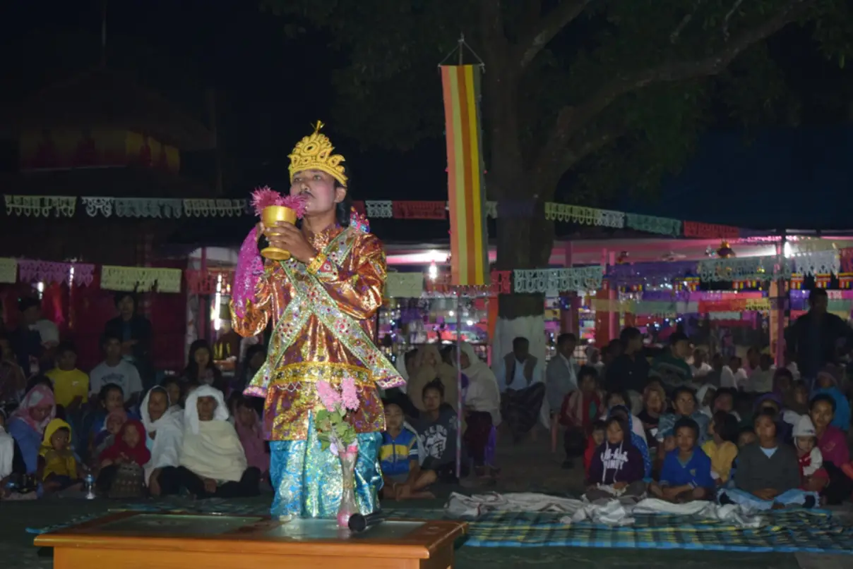 A Khamti actor pays reverence before performing Ka Pung at the Poi Lu Fra festival in Chongkham, Arunachal Pradesh, November 2017
