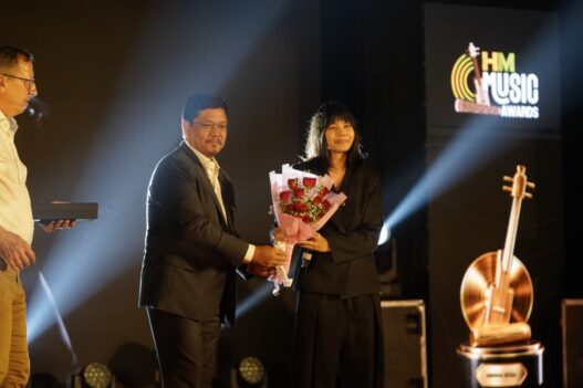 Meghalaya Chief Minister Conrad K. Sangma felicitates artist Reble after she was named Icon of the Year at the inaugural Hello Meghalaya Music Awards held in Shillong on World Music Day 2026.